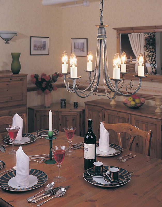 The Elstead Minster 6 light dual-mount rustic chandelier in black and gold is versatile and attractive. Made in England, and featuring pleasing looped drapes, is easily converted to a semi-flush mount and accepts optional glass shades