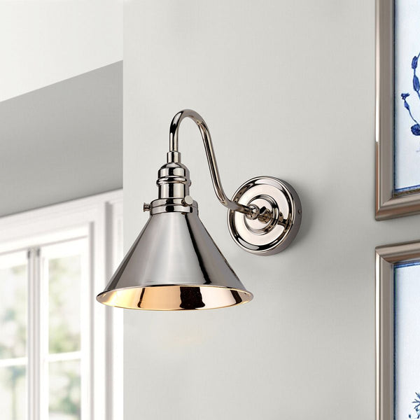 Elstead Provence 1 Light Wall Light in polished nickel, inspired by mid-1900s French designs. Features an adjustable knuckle for directional lighting, elegant aesthetics, and durable steel construction.