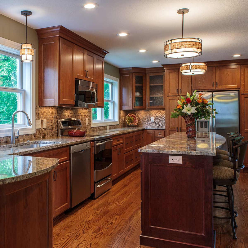 Elstead Laguna 1-Light Drum Pendant Light features a taupe mica shade with copper-toned mosaic tile accents, offering warm and inviting accent lighting for kitchens, hallways, or bedside spaces.