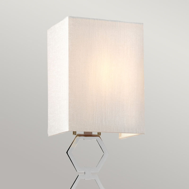Elstead Ria Small 1 Light Wall Light in polished chrome, featuring a handcrafted ivory faux silk shade and an elegant octagonal finial. A compact and stylish lighting solution with dimmable functionality.
