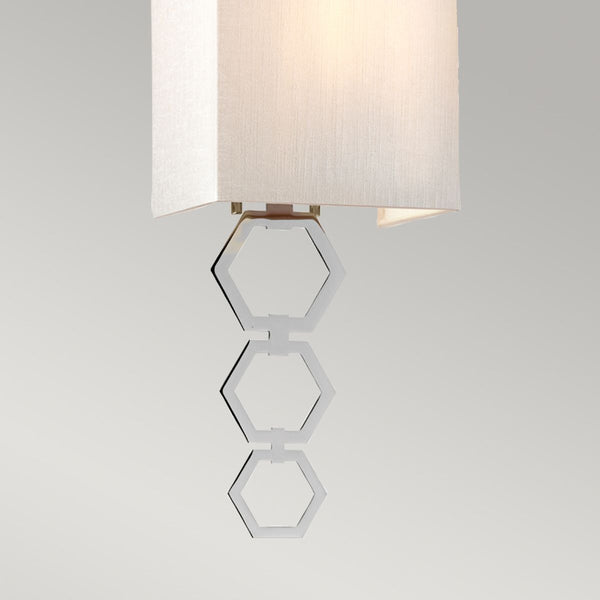 Elstead Ria Small 1 Light Wall Light in polished chrome, featuring a handcrafted ivory faux silk shade and an elegant octagonal finial. A compact and stylish lighting solution with dimmable functionality.