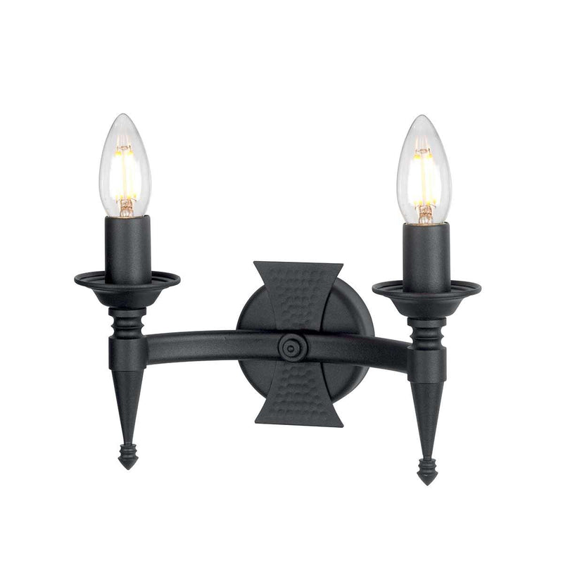 Elstead Saxon 2 Light Wall Light in black wrought iron, featuring decorative beaten metal panels for a medieval-inspired look. A perfect lighting solution for period and rustic interiors.