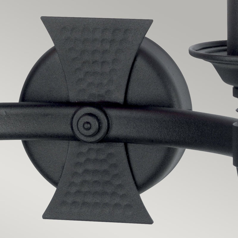 Elstead Saxon 2 Light Wall Light in black wrought iron, featuring decorative beaten metal panels for a medieval-inspired look. A perfect lighting solution for period and rustic interiors.