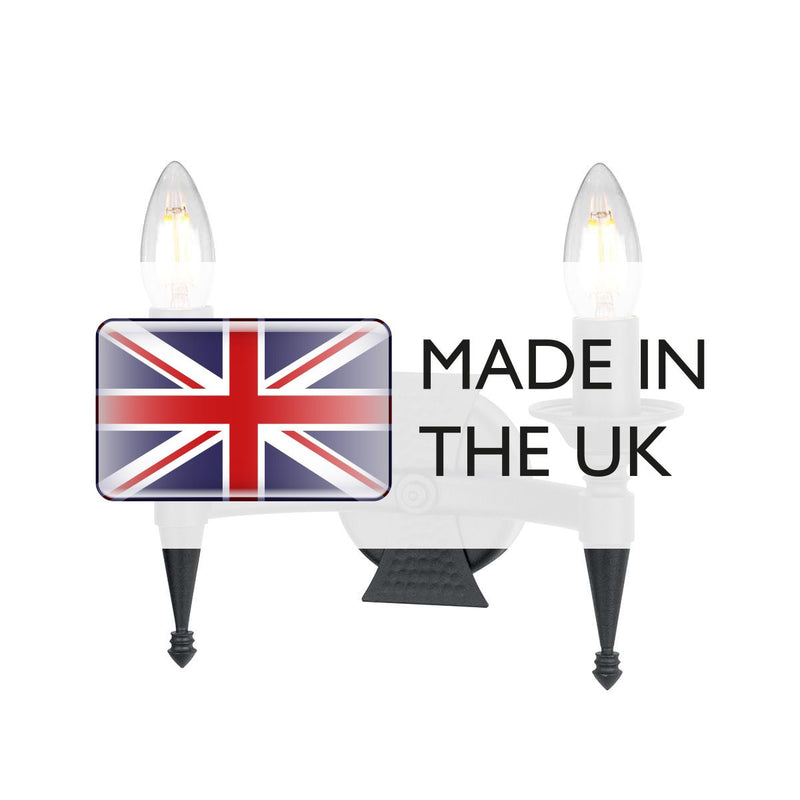 Elstead Saxon 2 Light Wall Light in black wrought iron, featuring decorative beaten metal panels for a medieval-inspired look. A perfect lighting solution for period and rustic interiors.