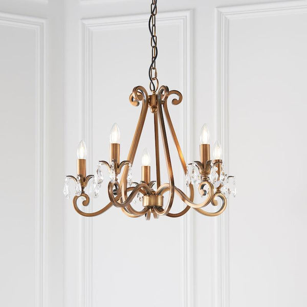 Interiors 1900 Oksana 5-Light Crystal Chandelier in Antique Brass – A classic chandelier featuring an antique brass finish, faceted crystal details, and five elegantly curved arms. Adjustable height (59cm-149cm), dimmable compatible, and uses 5 x E14 bulbs (not included).