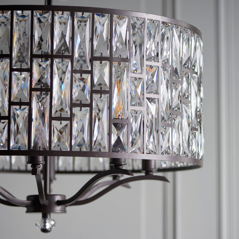 Endon The Belle 8 light pendant mixes high quality faceted clear crystals, arranged in a striking tiered pattern, with an understated dark bronze effect finish. Once lit each crystal combines to create an intensified decorative light effect. Perfect for timeless classic interiors.