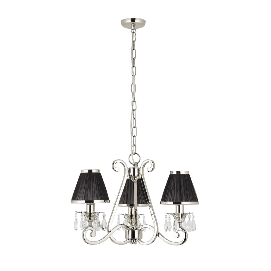 This 3-light candle chandelier is from our Oksana nickel range by Interiors 1900. The Oskana Nickel 3-light pendant is an impressive candle chandelier fitting. Finished in polished nickel plate. Suitable for hallways, living rooms, and dining rooms.  Complement your room Decor with this Oksana Nickel 3 Light stunning piece, which features faceted lead crystal droplets and black pleated shades. Matching items are available and compatible with dimmable LED lamps.