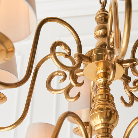 The Chamberlain 12-light pendant is a classic, solid brass candle chandelier with a soft, mellow brass finish and beautifully curved detailing. Made to the highest quality materials using traditional casting techniques, and then hand finished with cream candle drips & fitted marble silk pleated shades to complete the look. Supplied in 2 lengths. 
