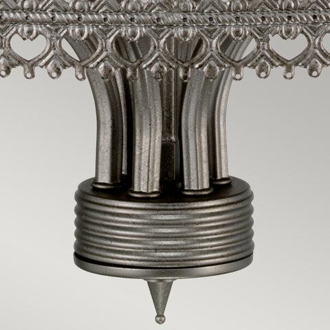 This Elstead Crown 6 light chandelier ceiling light in iron gate finish is traditional and rustic. Featuring a ceiling mount, chain suspension and central rod, with filigree metalwork rim and curving arms attached to tall candle style lights.