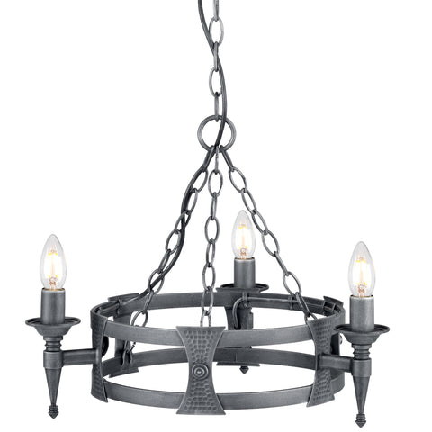 This Elstead Saxon black and silver wrought iron 3 light cartwheel chandelier has two metal bands for the cartwheel rim, with hand-crafted beaten shields decorating the outer rim. Each of the three torchière light arms is mounted on a shield and features tapered finials and forged metal candle pans. It is all suspended from three chains attached to a central chain hanging from a circular ceiling mount.